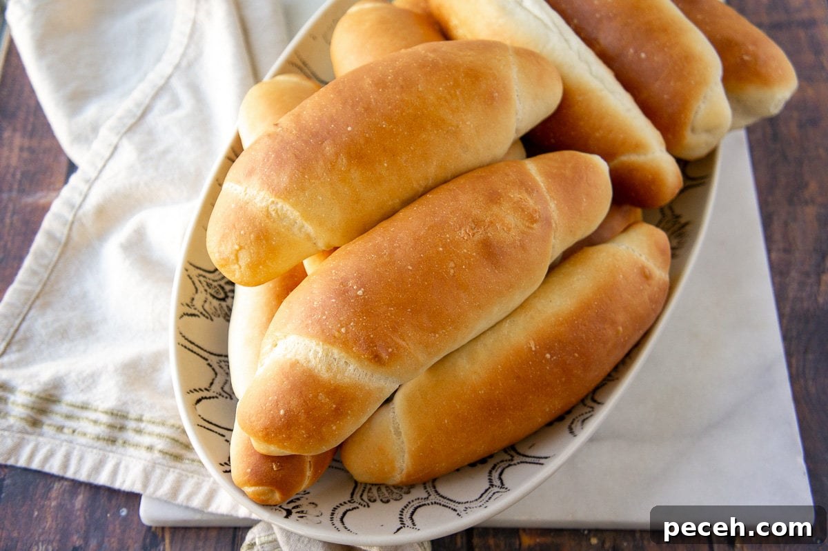 How to Make Soft Homemade Hot Dog Buns 2 a bowl of homemade hot dog buns on a towel
