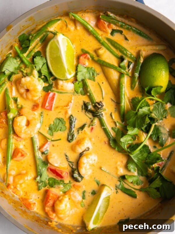 Creamy Sweet Potato Satay Curry with Coconut & Lime 11 overhead shot of Thai red prawn curry in large shallow frying pan.