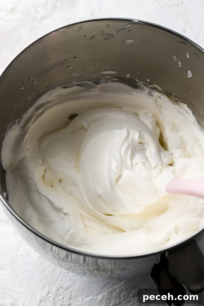 Light and Fluffy Banana Pudding Cake Recipe 9 finished chantilly cream in a bowl