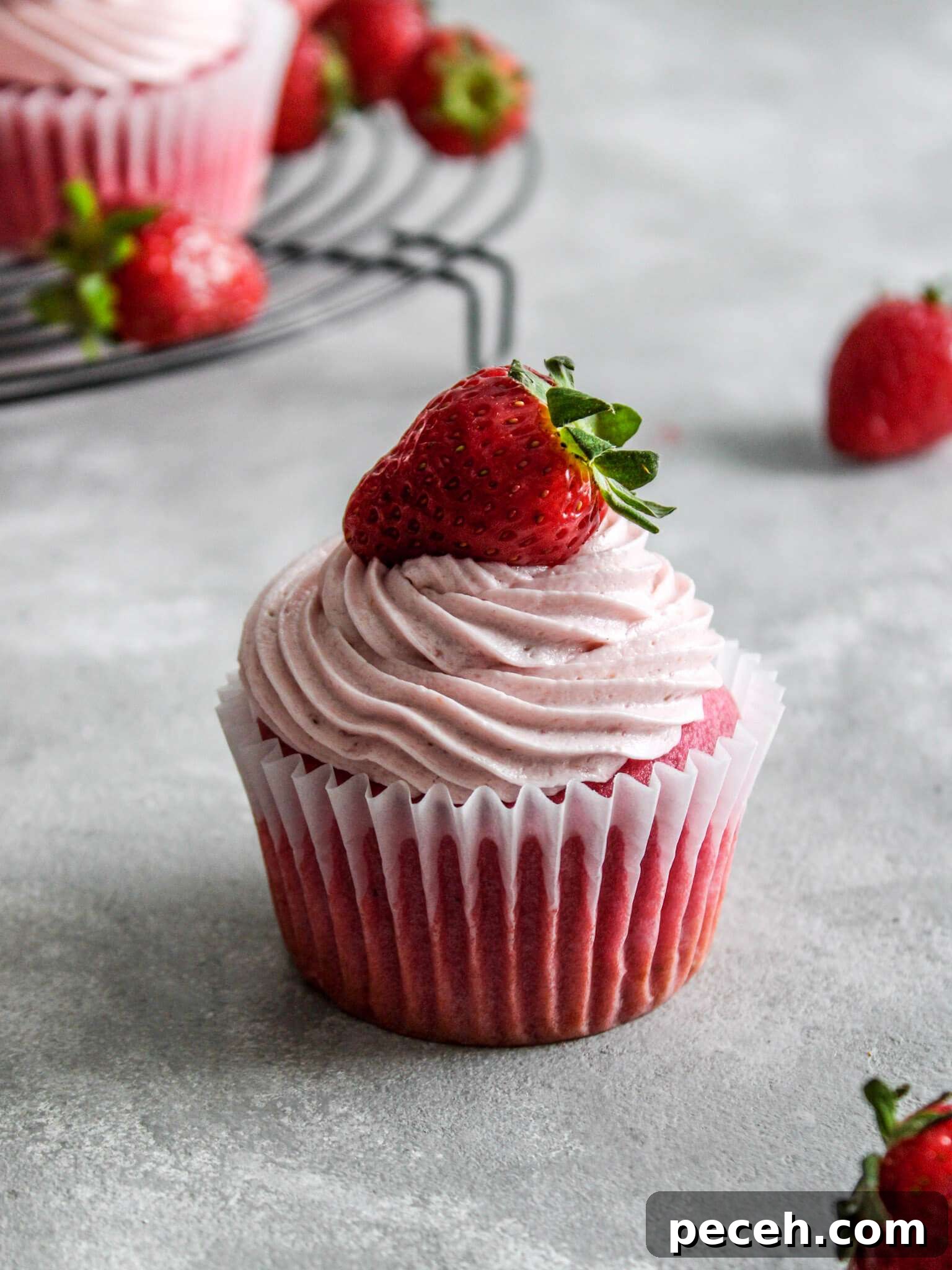 Fluffy Strawberry Cupcakes with Fresh Strawberry Frosting 2 frosted strawberry cupcake on table (3)