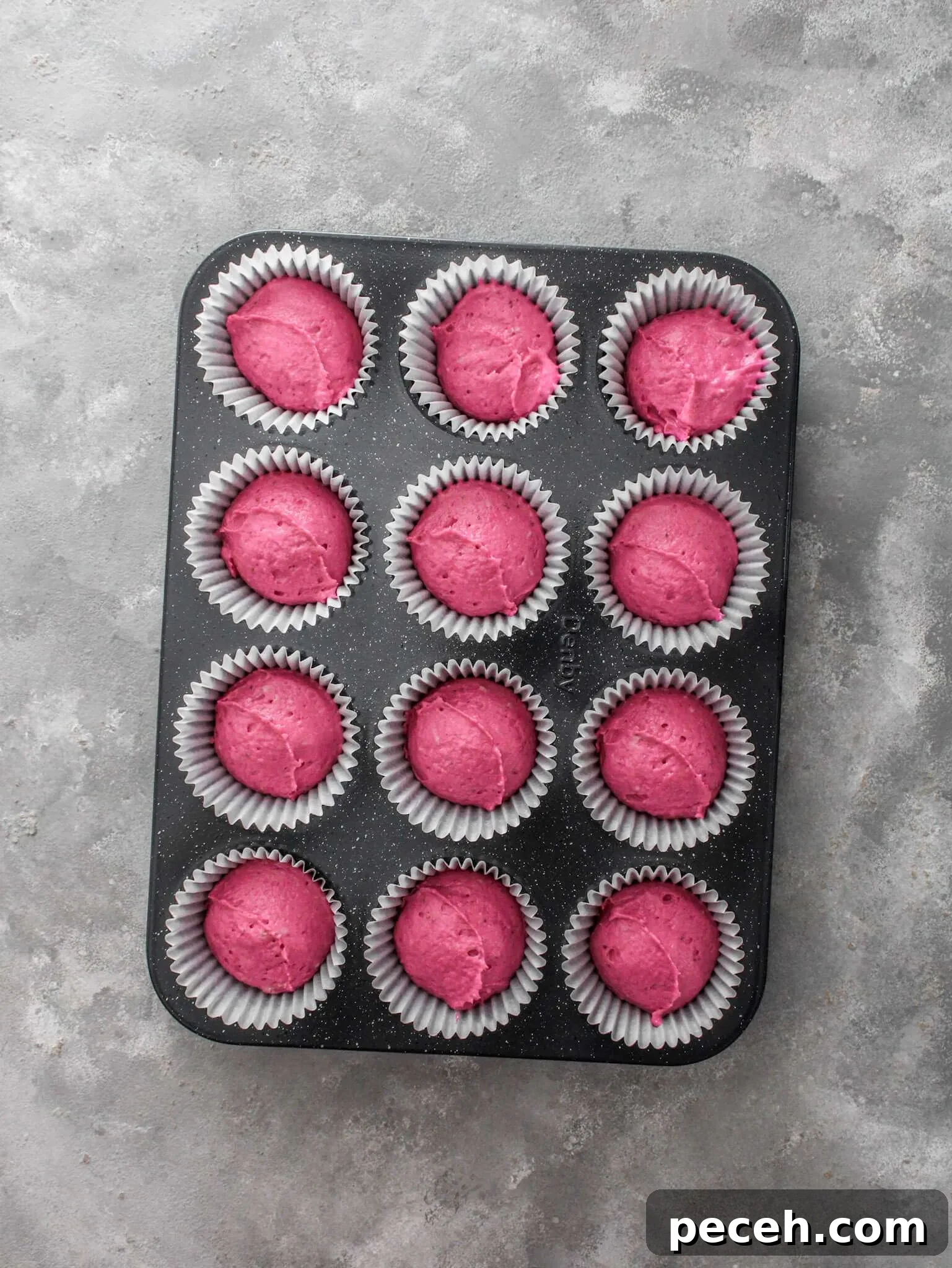 Fluffy Strawberry Cupcakes with Fresh Strawberry Frosting 7 strawberry cupcake batter portioned into cupcake tin