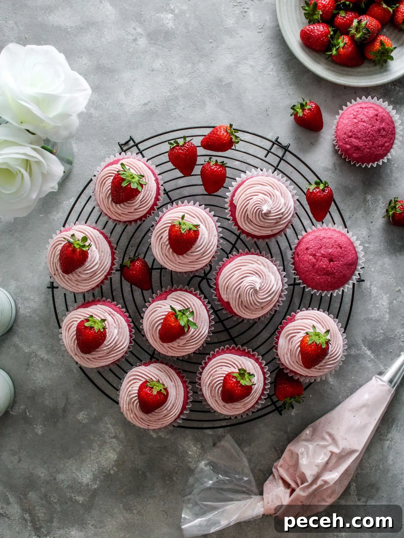 Fluffy Strawberry Cupcakes with Fresh Strawberry Frosting 5 frosted strawberry cupcakes on wire rack (1)