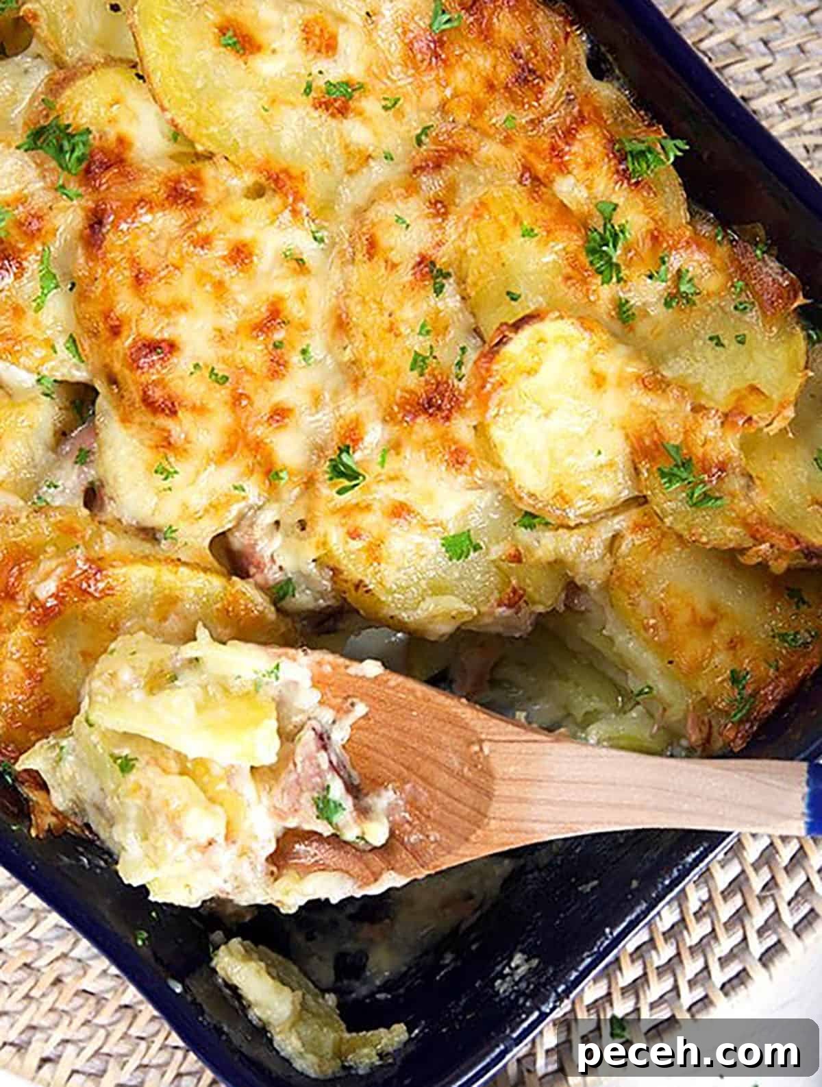 Leftover Ham Recipes: Tasty Ideas for Simple Meals 3 Overhead shot of scalloped potatoes and ham casserole in a baking dish.