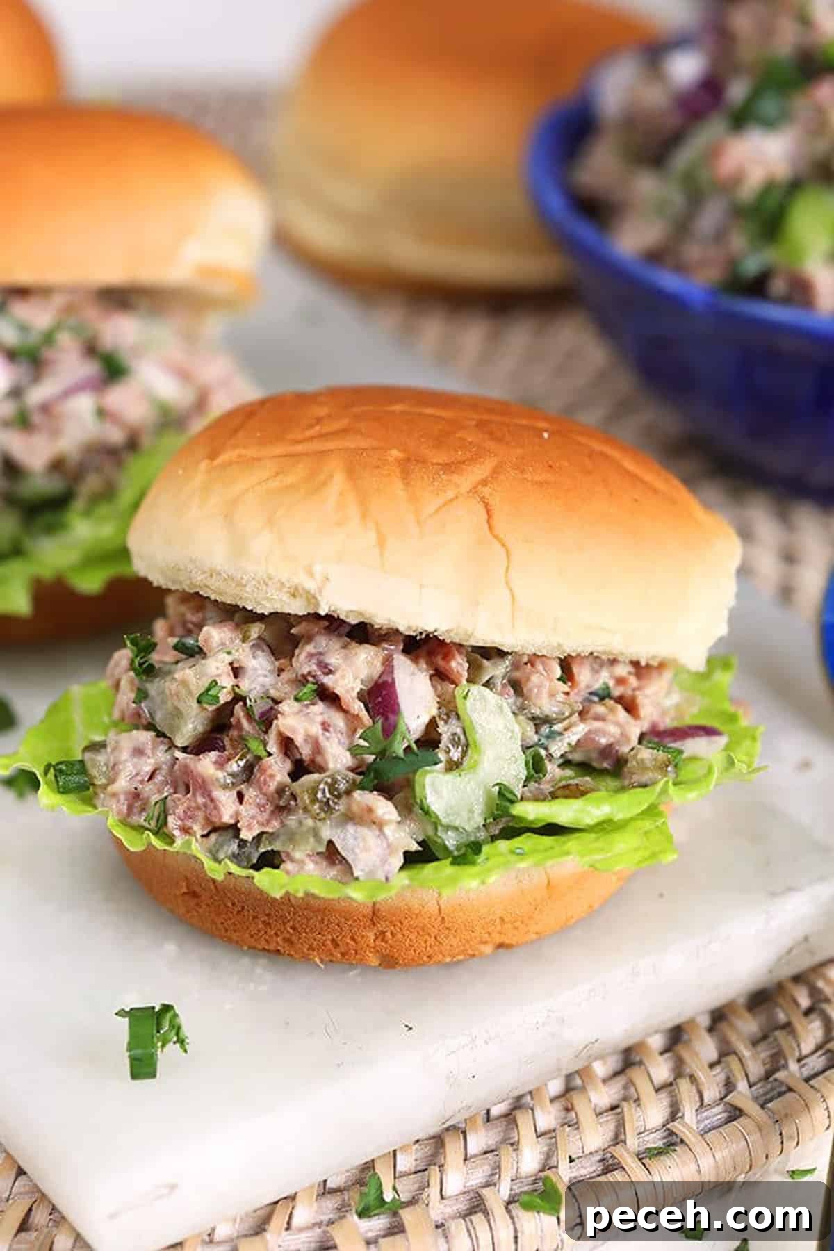 Leftover Ham Recipes: Tasty Ideas for Simple Meals 4 Close up of ham salad sandwich on a potato roll.