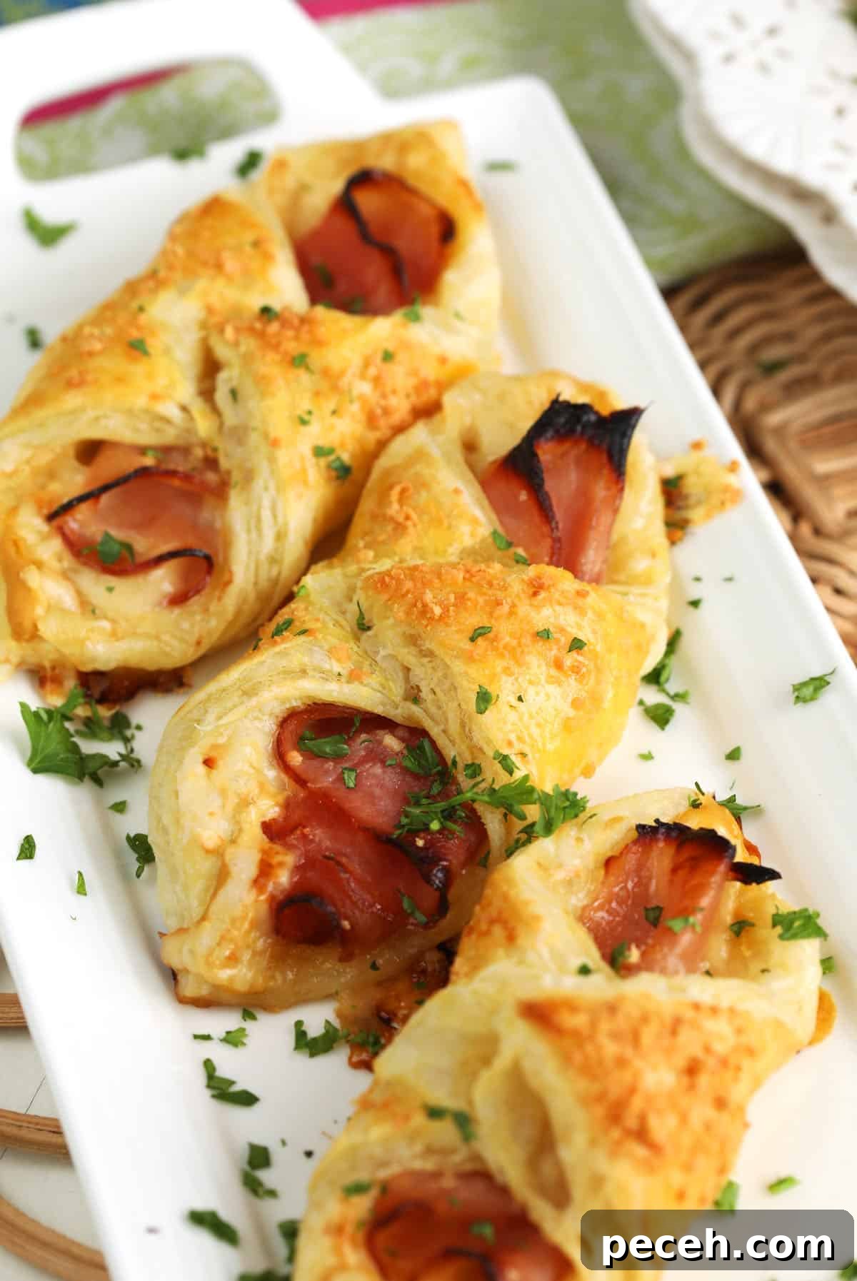 Leftover Ham Recipes: Tasty Ideas for Simple Meals 9 Ham and cheese croissants on white serving platter