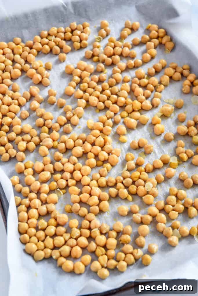 Crispy Roasted Chickpea Caesar Salad 6 chickpeas on a sheet pan before roasting.