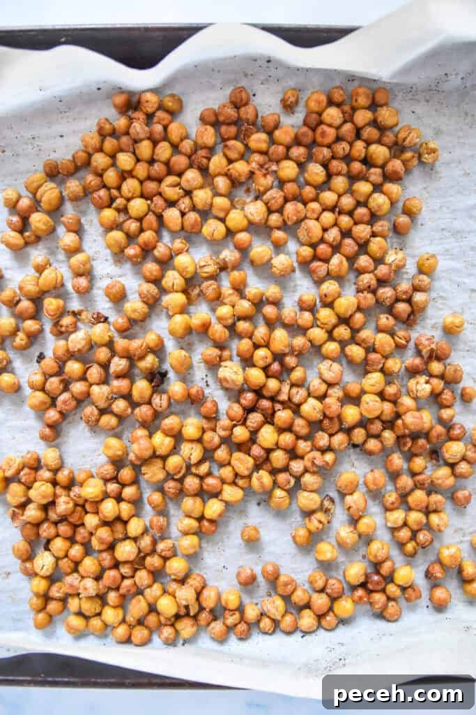 Crispy Roasted Chickpea Caesar Salad 7 roasted chickpeas on a sheet pan.