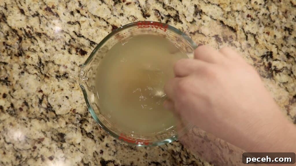 Creamy Garlic Chicken Pasta in the Instant Pot 11 Stirring base with water to form broth