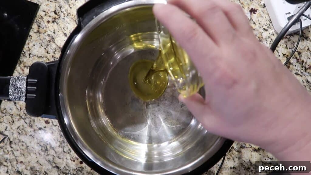 Creamy Garlic Chicken Pasta in the Instant Pot 12 Adding olive oil to instant pot