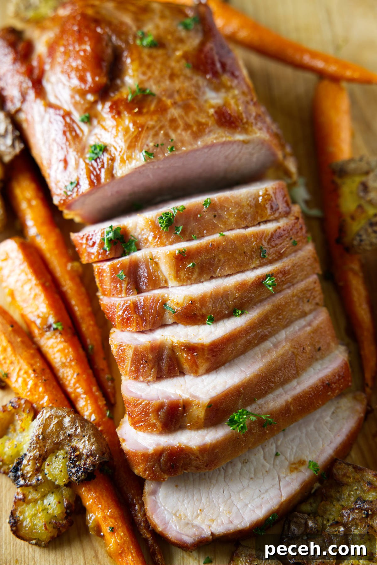 Smoked Pork Loin Recipe for Tender, Flavorful Meat 2 sliced whole smoked pork loin on cutting board