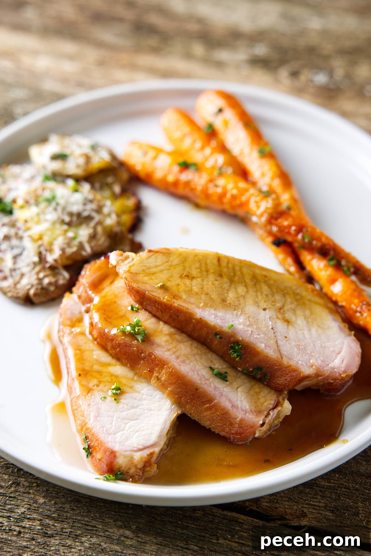 Smoked Pork Loin Recipe for Tender, Flavorful Meat 12 smoked pork loin sliced and plated with a glaze drizzled over top